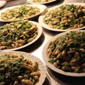 Handmade orecchiette with braised greens, broccoli rabe, and pickled garlic scapes in a beurre blanc sauce.