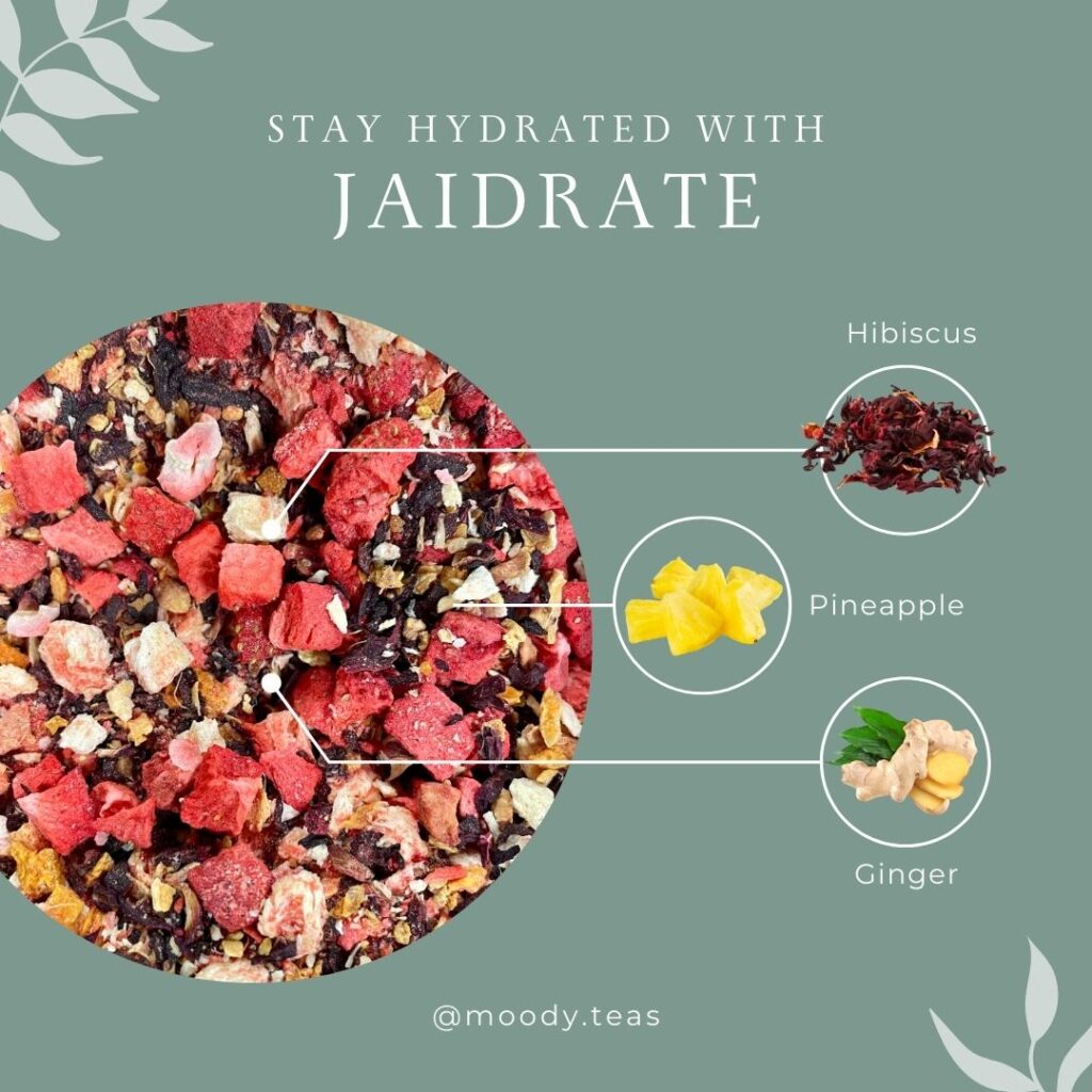 Vibrant loose tea blend with hibiscus, pineapple pieces, and ginger, labeled for staying hydrated.