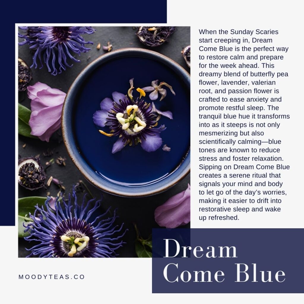 A vibrant, deep blue tea in a ceramic cup surrounded by butterfly pea flowers, lavender, and petals on a dark surface. The calming and beautiful hue of the tea is emphasized, reflecting the relaxing mood of the Dream Come Blue blend.